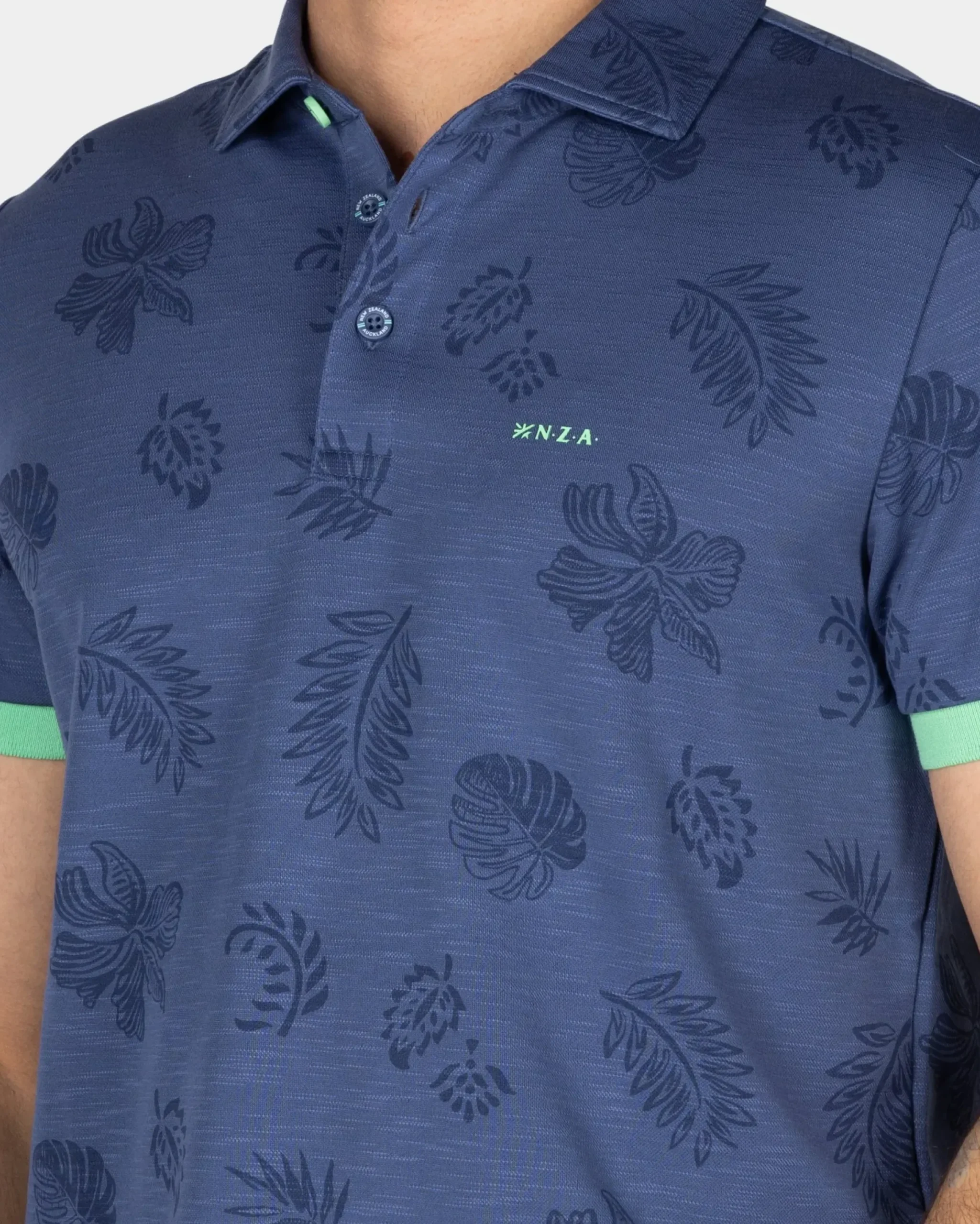 Blauw poloshirt met bladprint