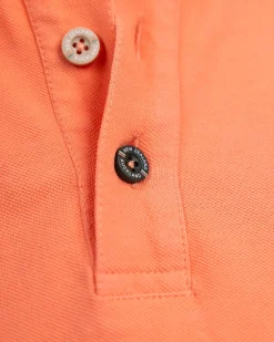 Effen katoenen koraalkleurige polo