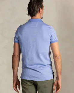 Effen lichtblauwe polo met oranje details