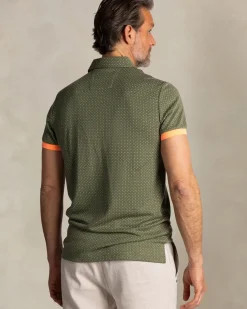 Groene polo met kleine oranje stippen