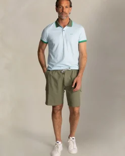 Lichtblauwe katoenen polo met groene kraag