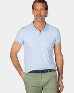 Pastelblauwe polo met oranje details