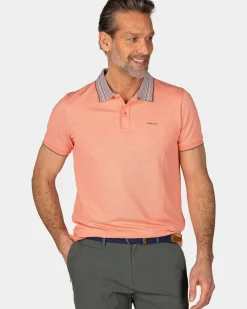 Pasteloranje polo met gestreepte kraag